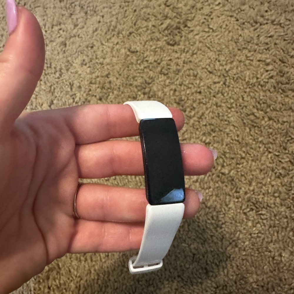 White FitBit Alta Tracker with Black Display